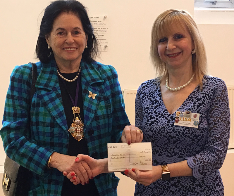 Cllr Lisa Rutter receiving a cheque from Lady Poppy Cooksey for Dementia Club UK Cllr Lisa Rutter receiving a cheque from Lady Poppy Cooksey for Dementia Club UK