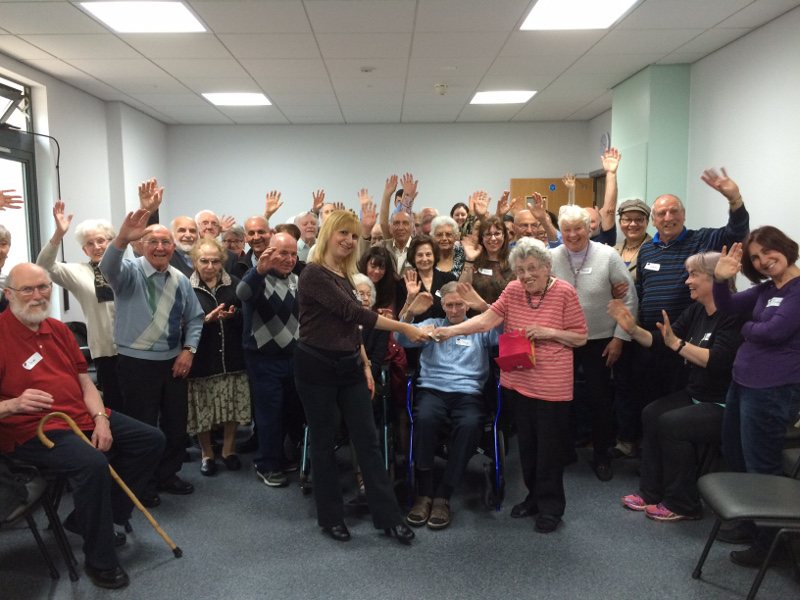 Diny presenting the proceeds of the Jewellery Sale to Lisa chairman of Dementia Club UK