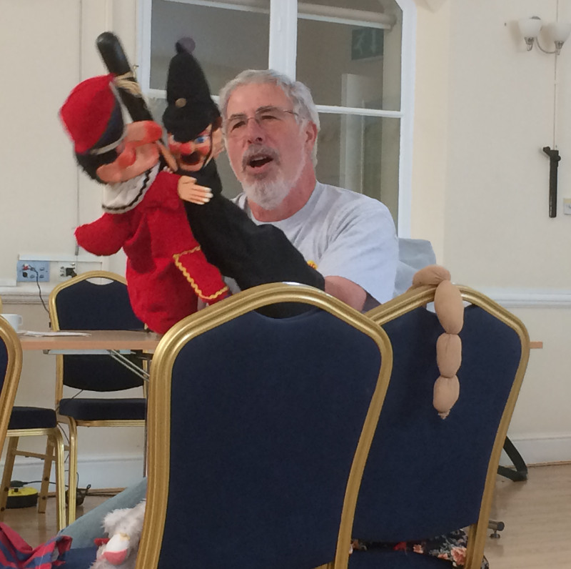 Michael Berg performing with Punch and the Policeman at Dementia Club UK Michael Berg performing with Punch and the Policeman at Dementia Club UK