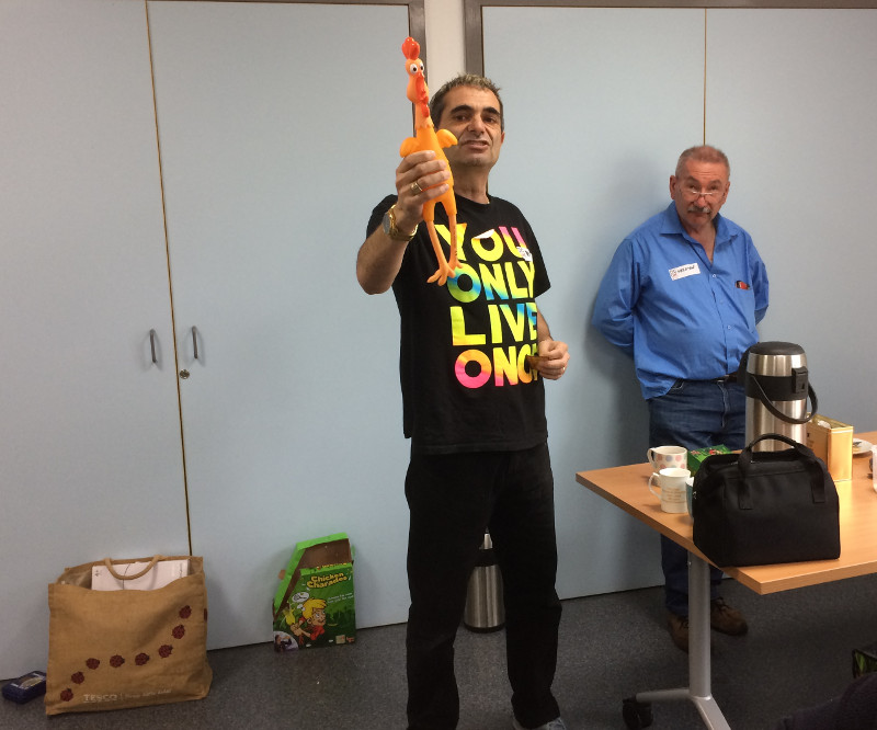 Kevin playing the game 'Chicken Charades' with volunteer Melvyn Kevin playing the game 'Chicken Charades' with volunteer Melvyn