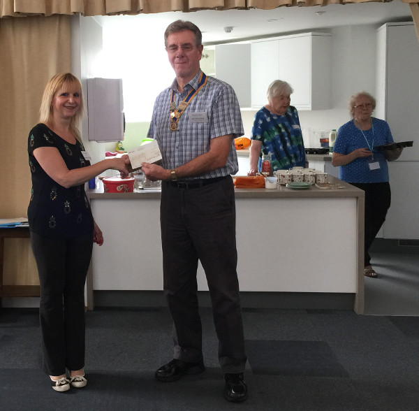 Lisa the Chairman of Dementia Club UK was presented with a cheque from Jim the President of Rotary Club of Barnet Lisa the Chairman of Dementia Club UK was presented with a cheque from Jim the President of Rotary Club of Barnet